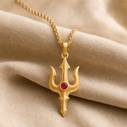 Ruby trident pendant necklace in 925 sterling silver with curved three-pronged relief design and a round vivid red center stone in a bezel-style setting. Gold finish.