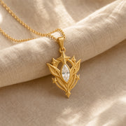 White Crystal Star Elf pendant in 925 sterling silver, featuring a faceted marquise clear crystal framed by pointed leaf forms, raised stars, and detailed celestial metalwork. Gold finish.