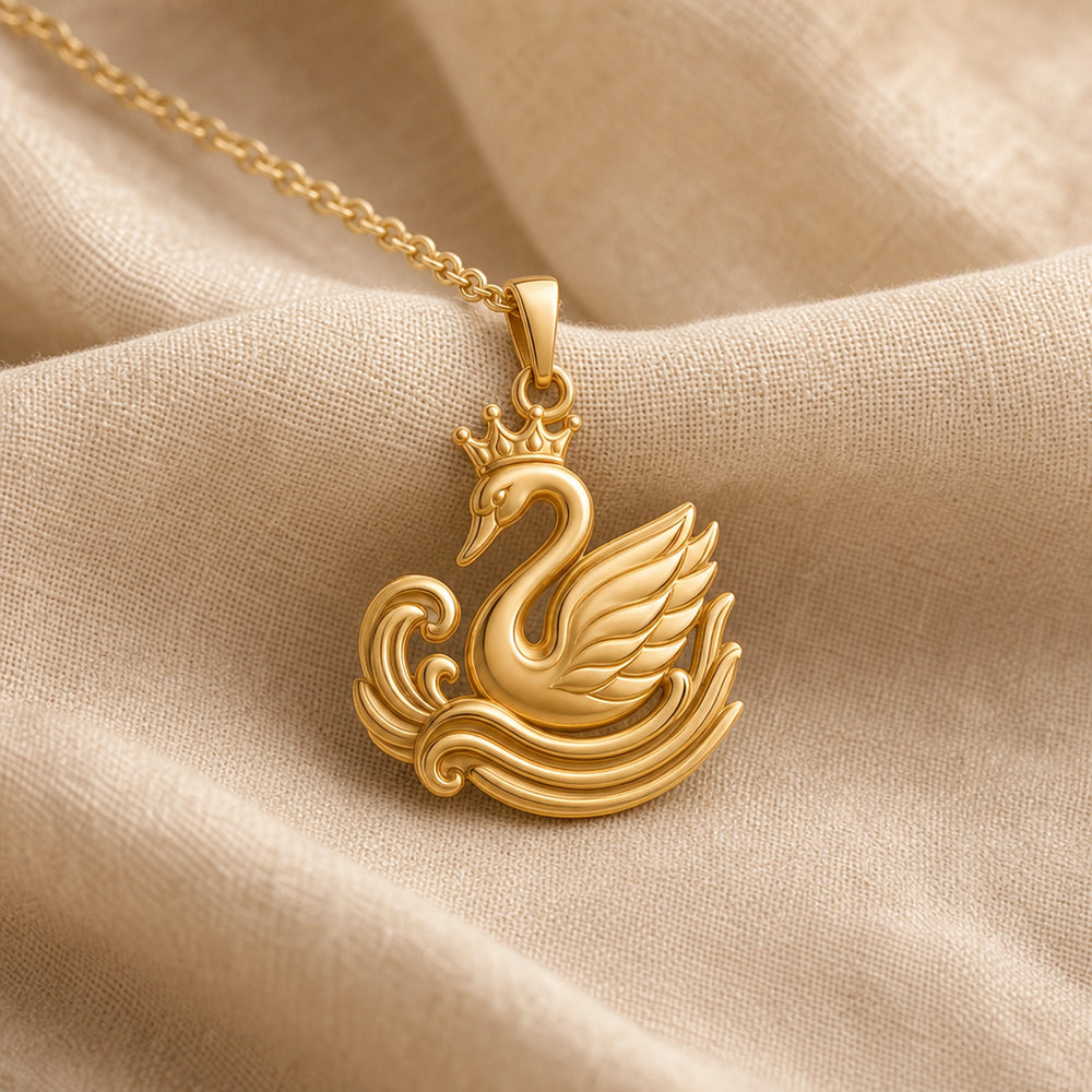 Crowned swan ripple pendant in a warm yellow finish, featuring a raised crown, curved swan neck, layered feather wing, and sculpted wave relief with no gemstone or stone setting. Gold finish.