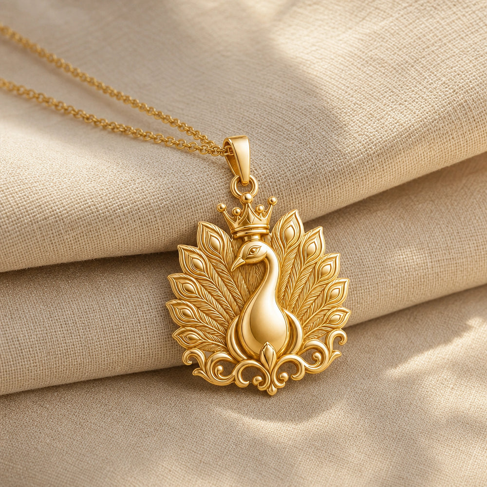 Imperial peacock crown pendant with a raised peacock, layered feather-plume relief, ornate scrolling base, and detailed crown on a cable chain. Gold finish.