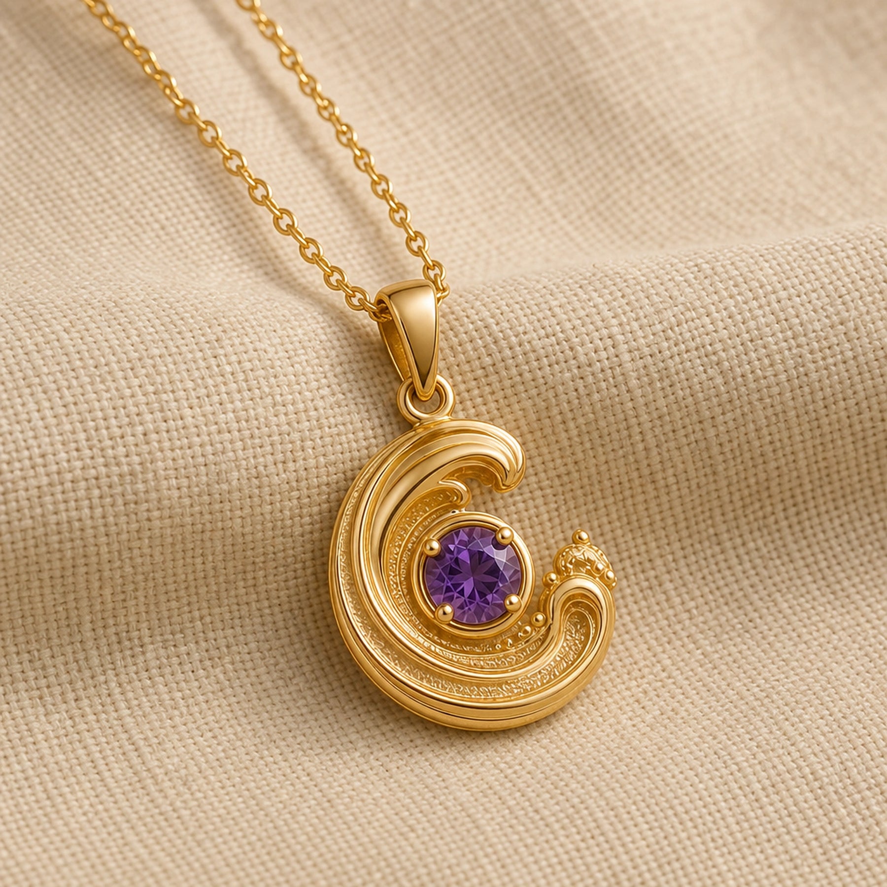 925 sterling silver wavecrest pendant curling around a round purple amethyst centerpiece with flowing textured details. Gold finish.