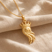 Star-crowned comet pendant with a raised central star, smaller stars along layered sweeping comet trails, and a detailed beaded crown in a warm yellow-toned finish. Gold finish.