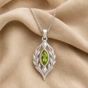 Blue Topaz Laurel Pendant with a green-toned faceted marquise stone, framed by detailed openwork laurel leaves in an elongated elven-inspired 925 sterling silver design. Silver finish.