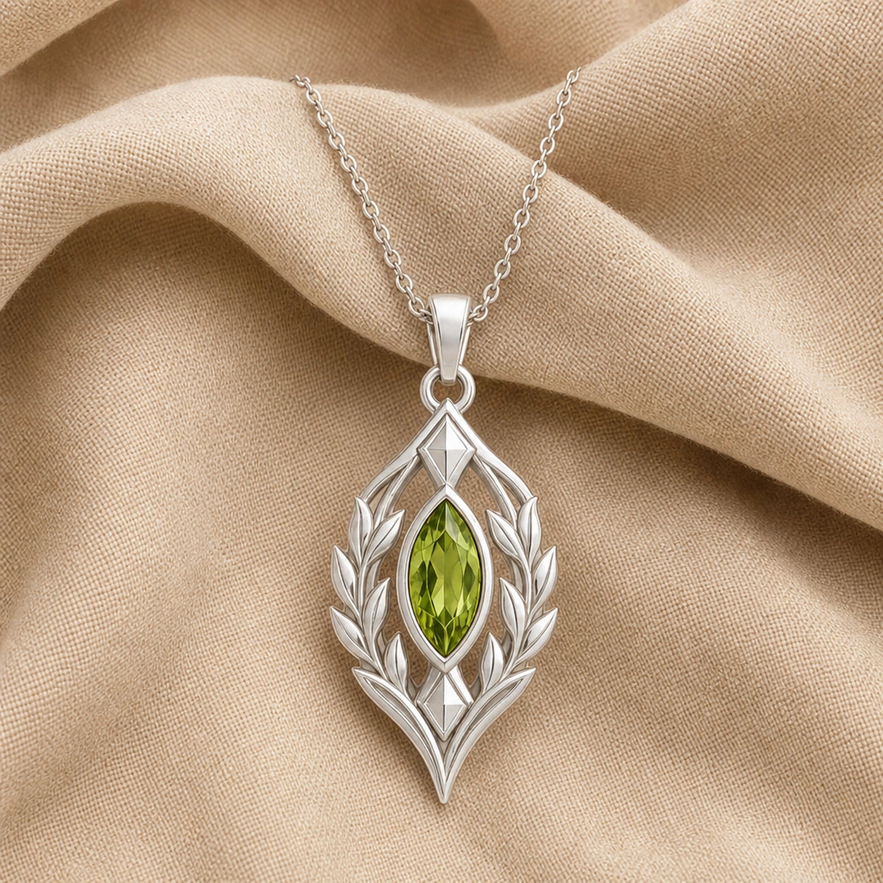 Blue Topaz Laurel Pendant with a green-toned faceted marquise stone, framed by detailed openwork laurel leaves in an elongated elven-inspired 925 sterling silver design. Silver finish.