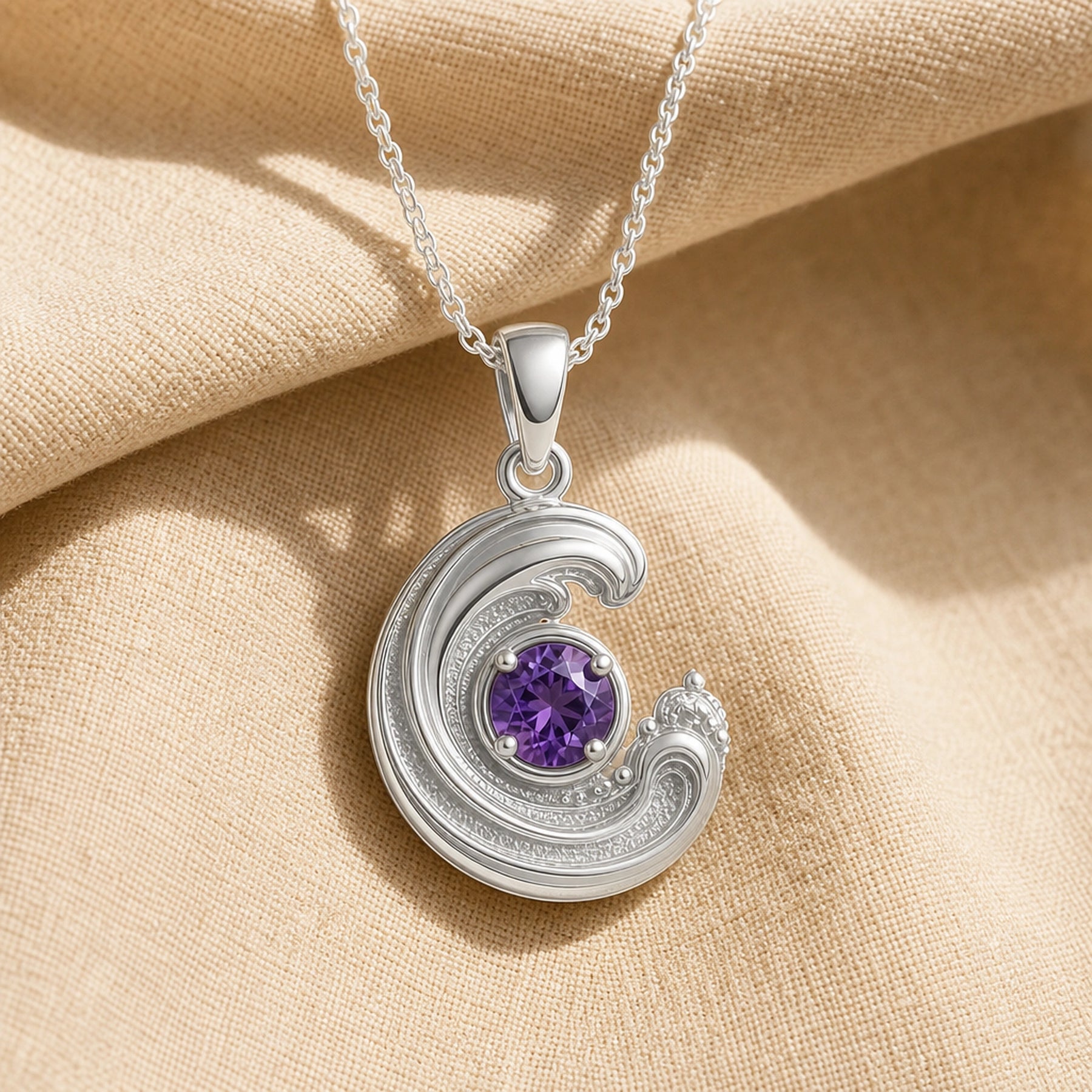 925 sterling silver wavecrest pendant curling around a round purple amethyst centerpiece with flowing textured details. Silver finish.