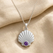 925 sterling silver fan-shaped seashell pendant with fluted relief and a round purple amethyst birthstone. Silver finish.