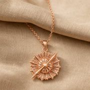 925 sterling silver round supernova quasar pendant with radiating relief and a highly textured celestial surface. Rose gold finish.