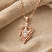 White Crystal Star Elf pendant in 925 sterling silver, featuring a faceted marquise clear crystal framed by pointed leaf forms, raised stars, and detailed celestial metalwork. Rose gold finish.