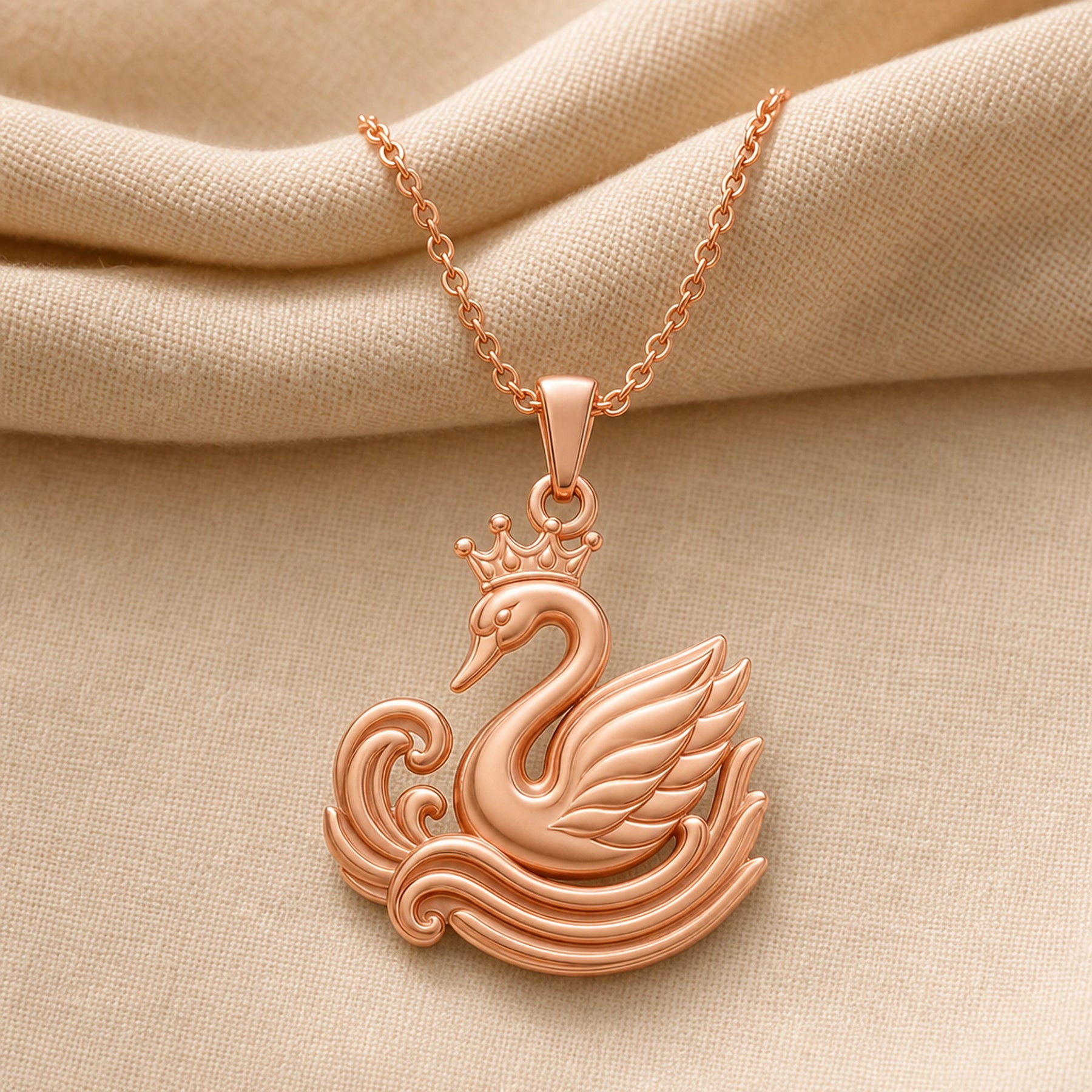 Crowned swan ripple pendant in a warm yellow finish, featuring a raised crown, curved swan neck, layered feather wing, and sculpted wave relief with no gemstone or stone setting. Rose gold finish.