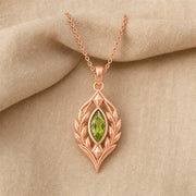 Blue Topaz Laurel Pendant with a green-toned faceted marquise stone, framed by detailed openwork laurel leaves in an elongated elven-inspired 925 sterling silver design. Rose gold finish.