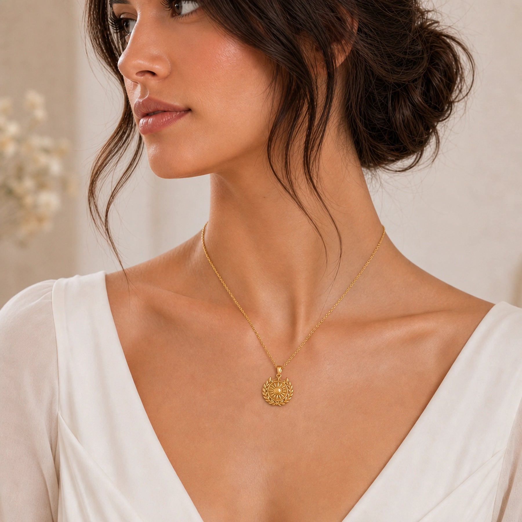 Royal sun laurel crown pendant with a raised sunburst center, polished circular medallion, detailed leaf wreath, and three-point crown on a cable chain. Worn on a model, angled view.