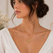 White Crystal Star Elf pendant in 925 sterling silver, featuring a faceted marquise clear crystal framed by pointed leaf forms, raised stars, and detailed celestial metalwork. Worn on a model, angled view.
