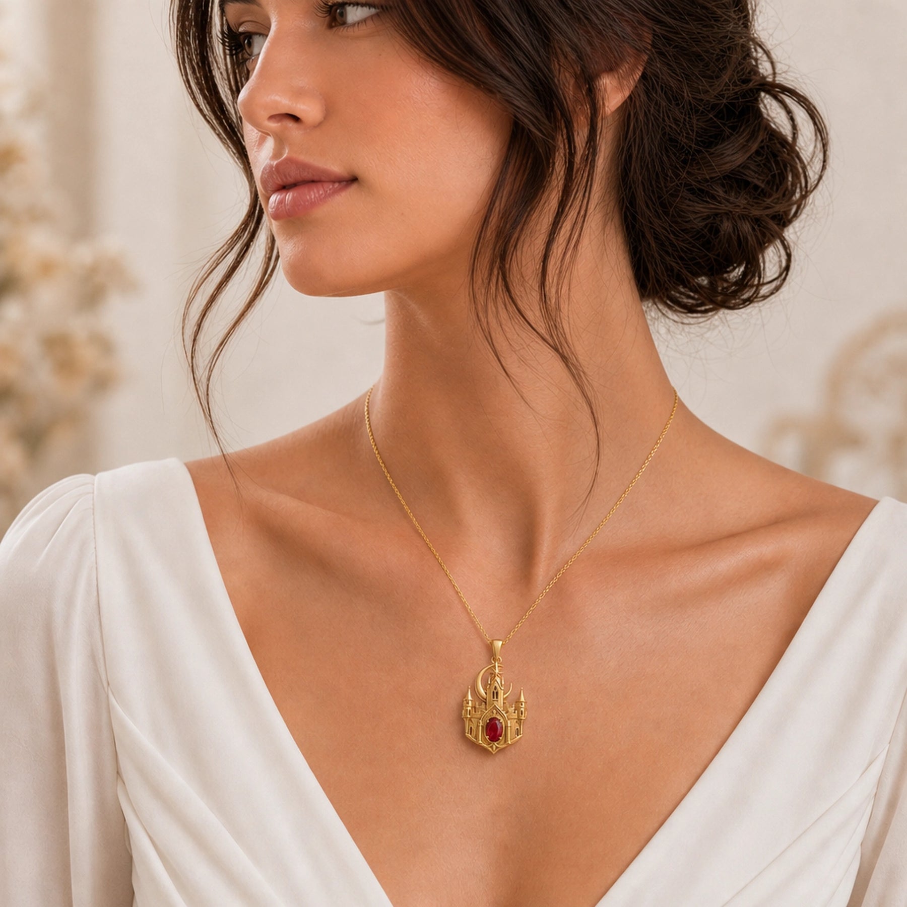 Ruby Moonspire Castle Pendant in 925 sterling silver with detailed pointed towers, arched windows, a crescent moon, star accent, and oval deep red ruby-colored stone in a prong setting. Worn on a model, angled view.
