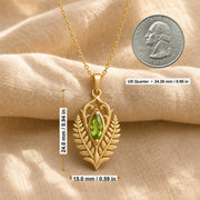 Marquise peridot fern pendant with a vivid green faceted stone in a smooth setting, framed by raised elven fern leaves, openwork scrolls, and botanical relief details. Product dimensions and measurements.
