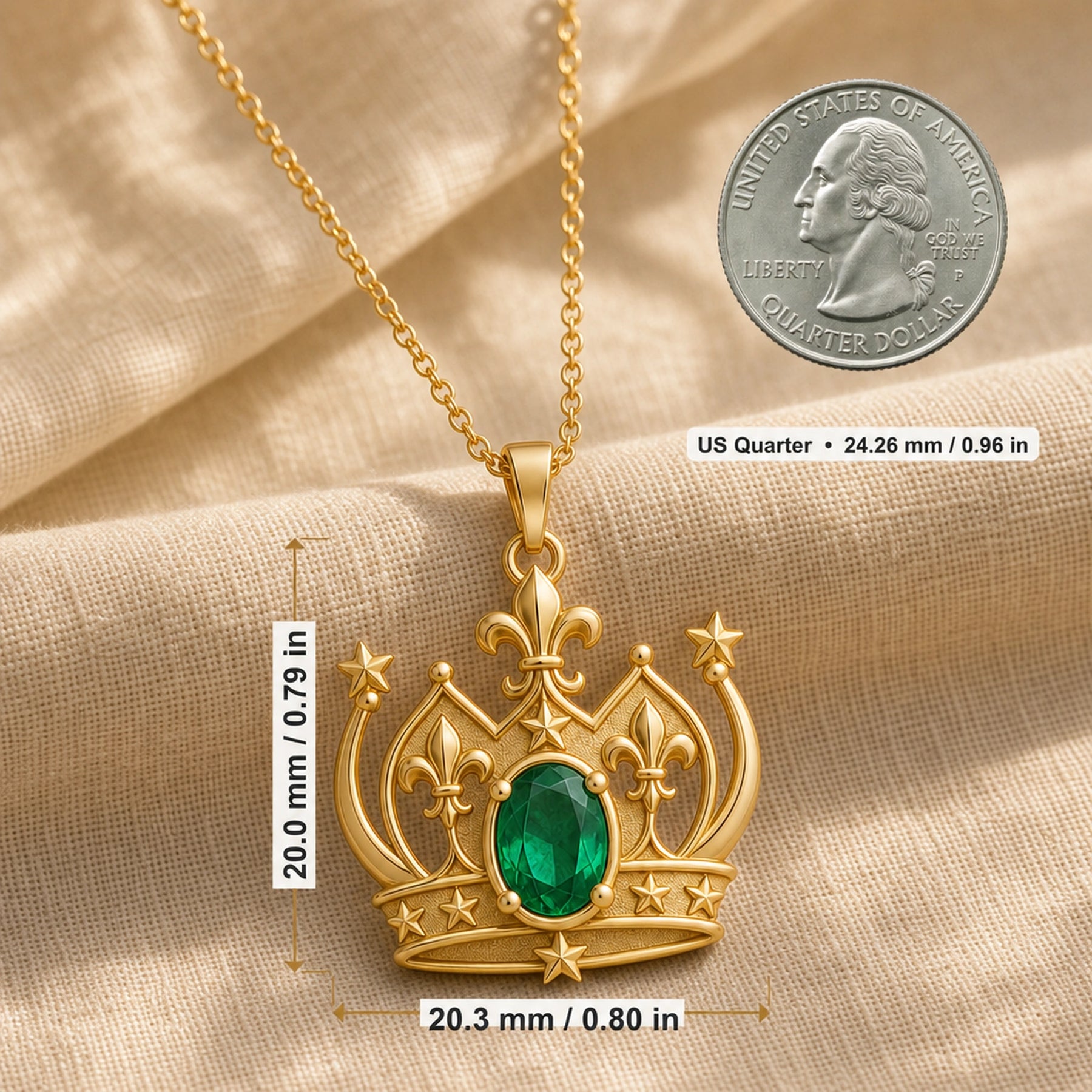 Emerald fleur-de-lis crown pendant with an oval green center stone in a raised prong setting, detailed star accents, sculpted crown arches, and ornate openwork metalwork. Product dimensions and measurements.