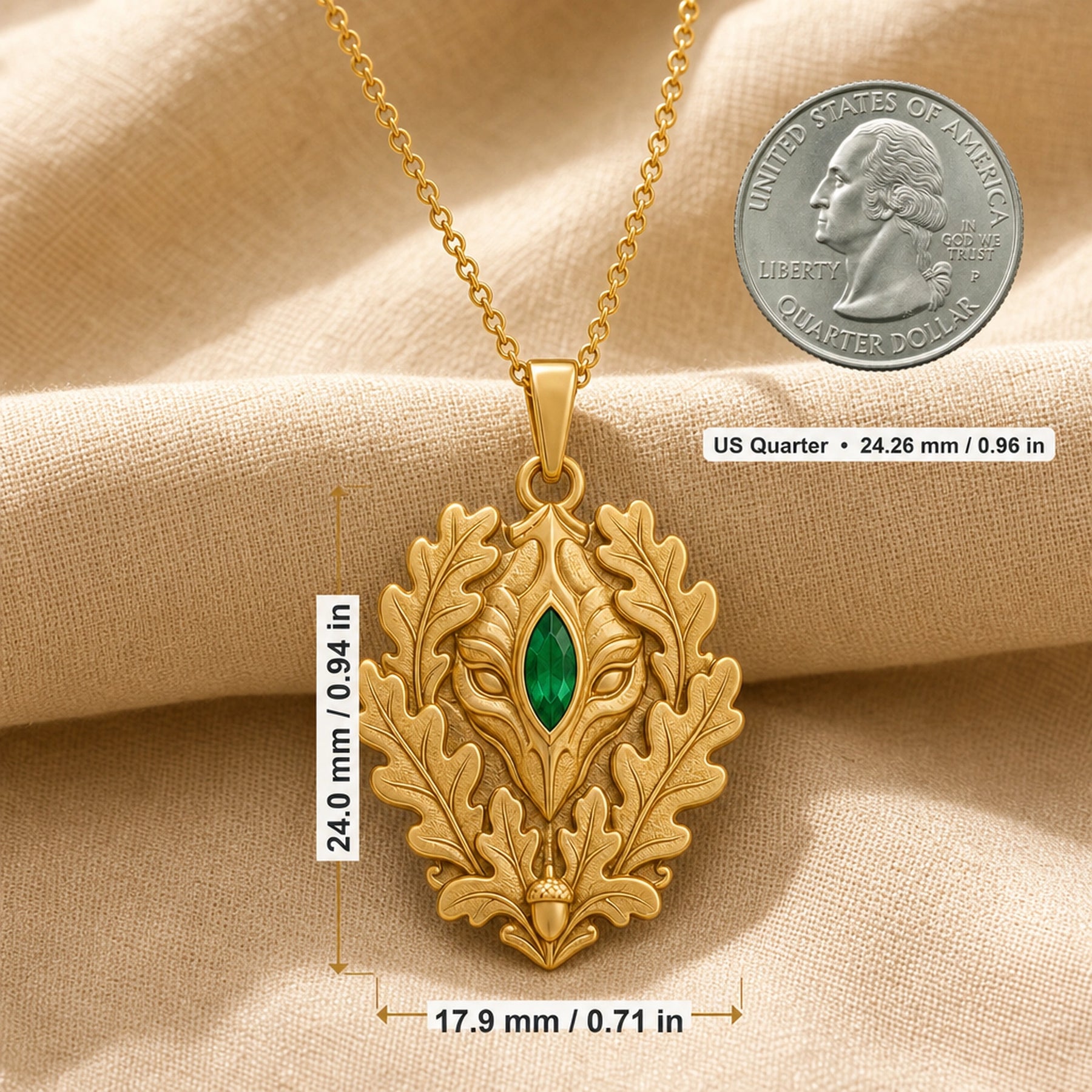 Marquise emerald oakleaf pendant with a vivid green stone set at the center of a sculpted guardian face, framed by raised oak leaves and an acorn detail. Product dimensions and measurements.