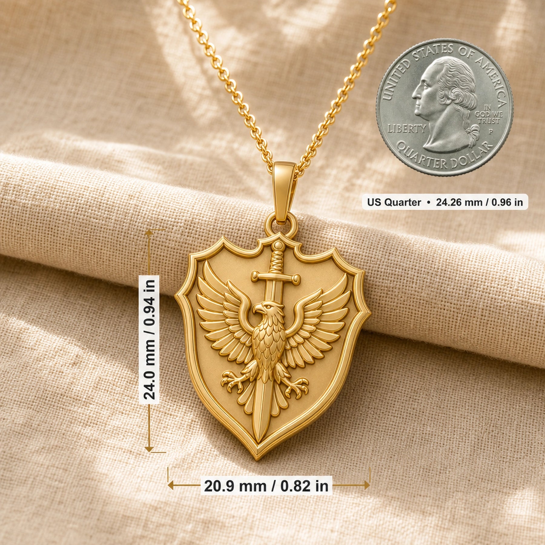 Heraldic eagle swordcrest pendant with a raised winged eagle, vertical sword, pointed shield frame, and detailed feather relief on a warm-toned cable chain. Product dimensions and measurements.