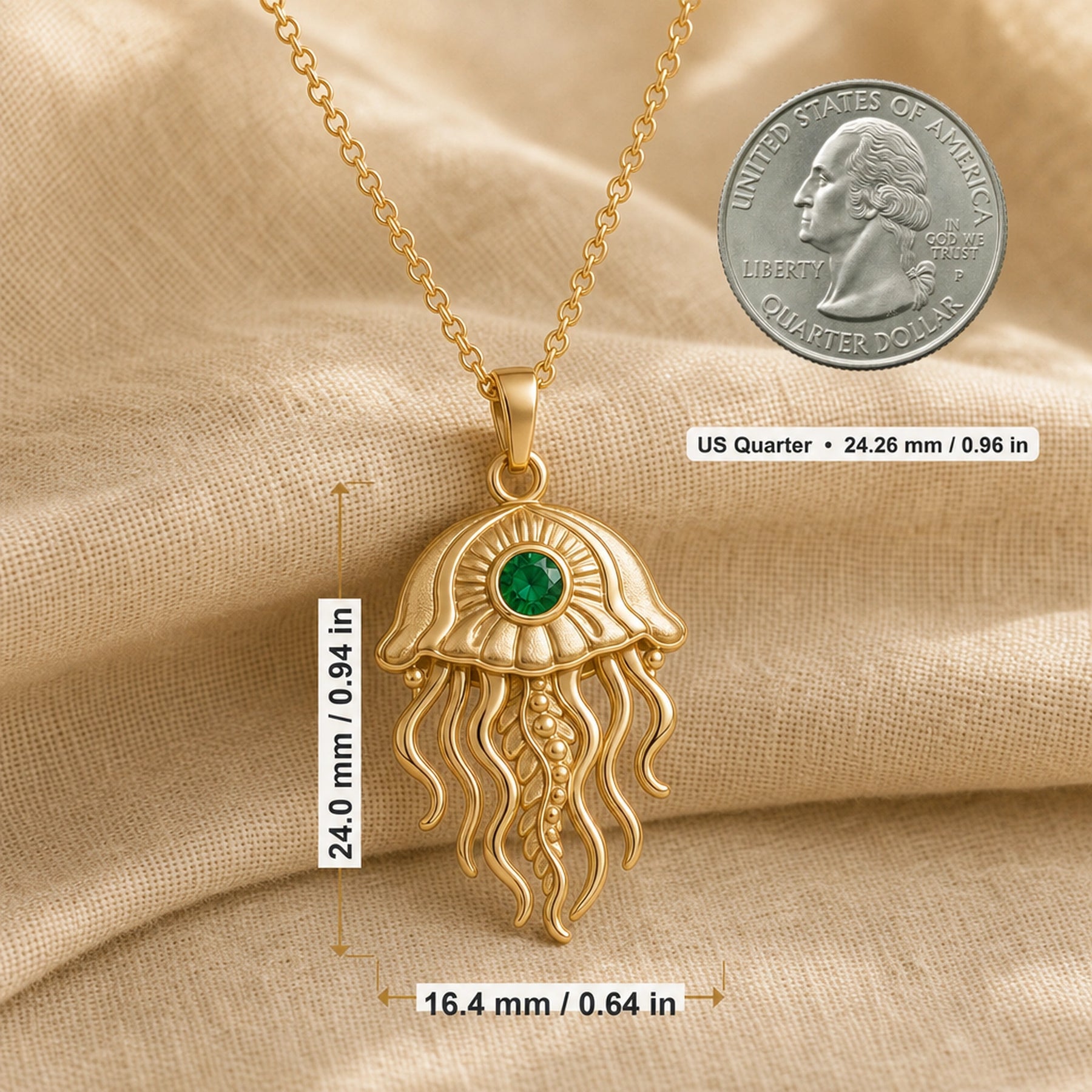 Emerald jellyfish pendant necklace with a round faceted green stone in a bezel-style setting, a textured domed bell, and flowing sculpted tentacles. Product dimensions and measurements.