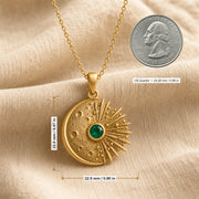 Kepler emerald supernova pendant with a cratered crescent moon, round green emerald center stone in a smooth setting, and detailed radiant starburst rays. Product dimensions and measurements.